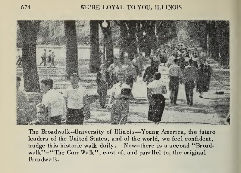 Crowded sidewalk filled with students, with large trees lining.