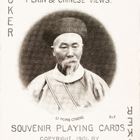 Joker card with text advertising the deck of cards and the photo of a man in the center