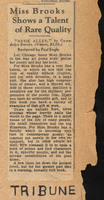 Newspaper clipping attached to a torn piece of folder with words "Tribune" handwritten across the bottom in blocky letters.